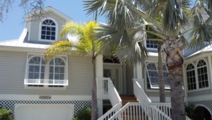 Eurex Bahama Shutters on tan house
