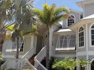 hurricane-shutters-cost-bahama bahama style hurricane shutters on a south florida home