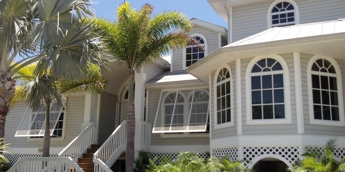 hurricane-shutters-pictures Bahama hurricane shutters over windows of a residential home