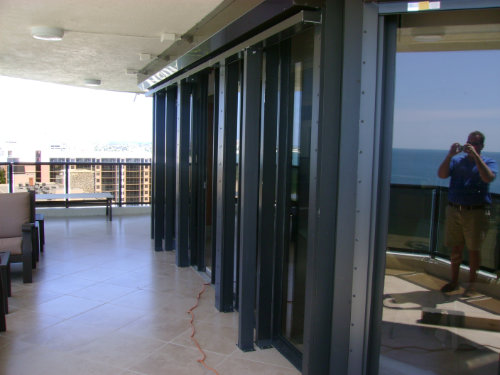 Accordion shutters on a condo balcony