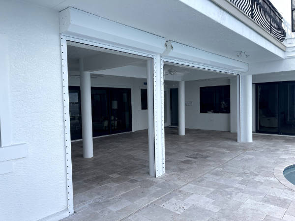 white roll down shutters on the patio of a home in Cape Coral fl