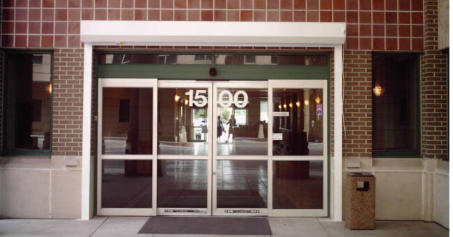 security-shutters-business-office white security shutters on commercial building