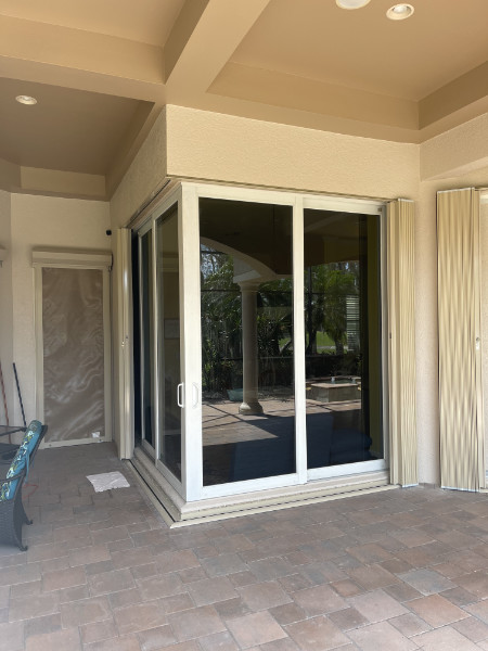 open accordion hurricane shutters on condo in estero fl