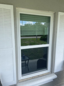 white impact windows with white shutters