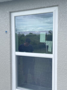 white hurricane windows on tan home in lehigh acres fl
