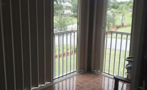 Shutters on a balcony lanai.