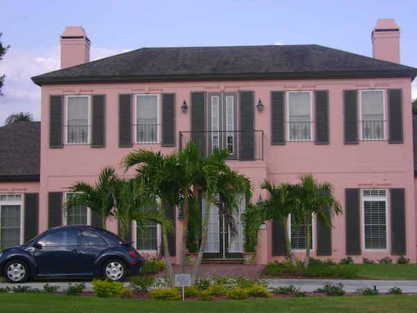 Colonial hurricane shutters are the perfect fit for a traditional home.