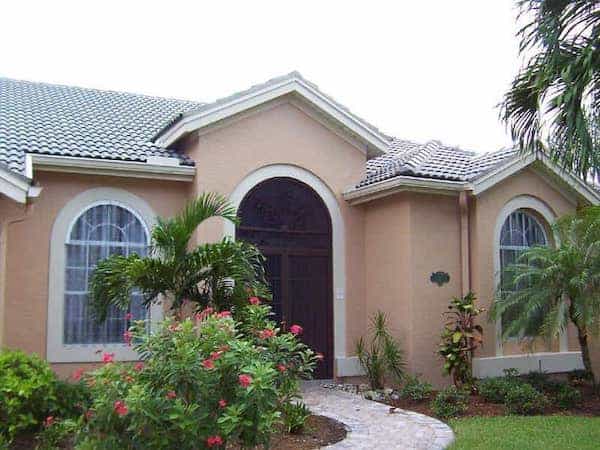 Clear storm panel shown on a beige house.