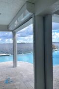 White automatic roll down hurricane shutters