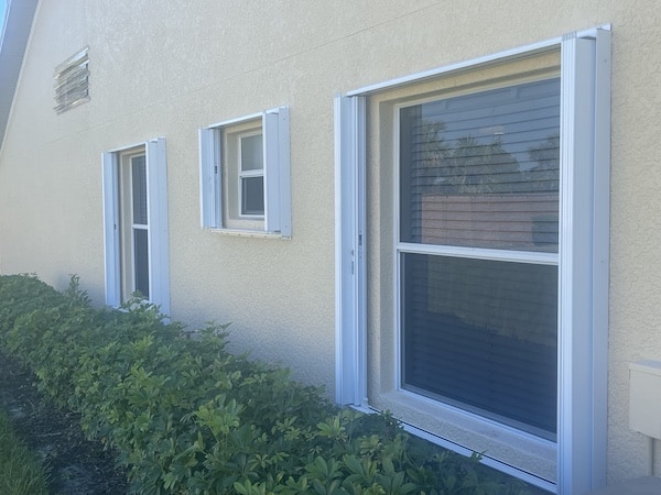 White accordion shutters in multiple sizes, open