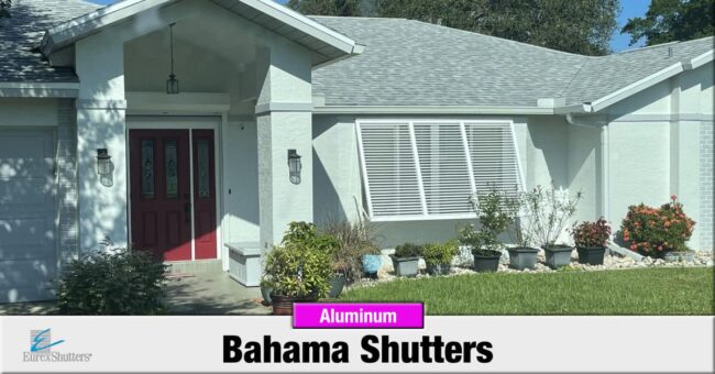White aluminum bahama shutters on a home