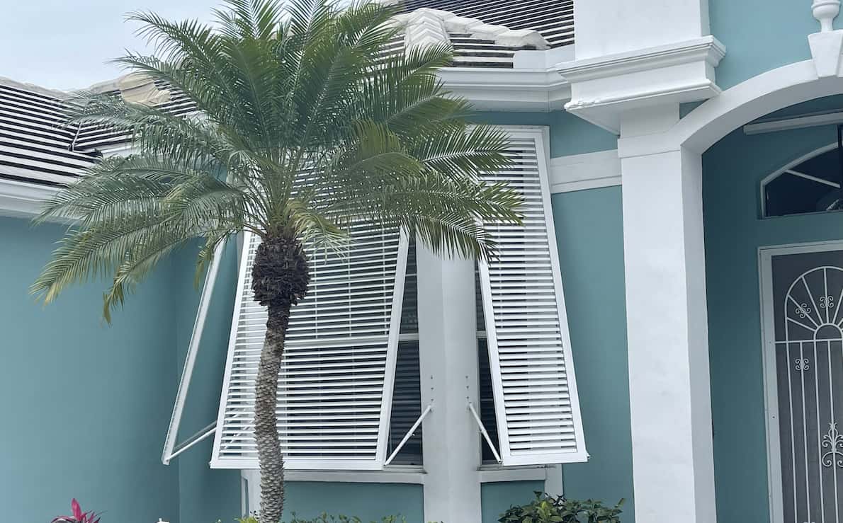 white shutters blue house