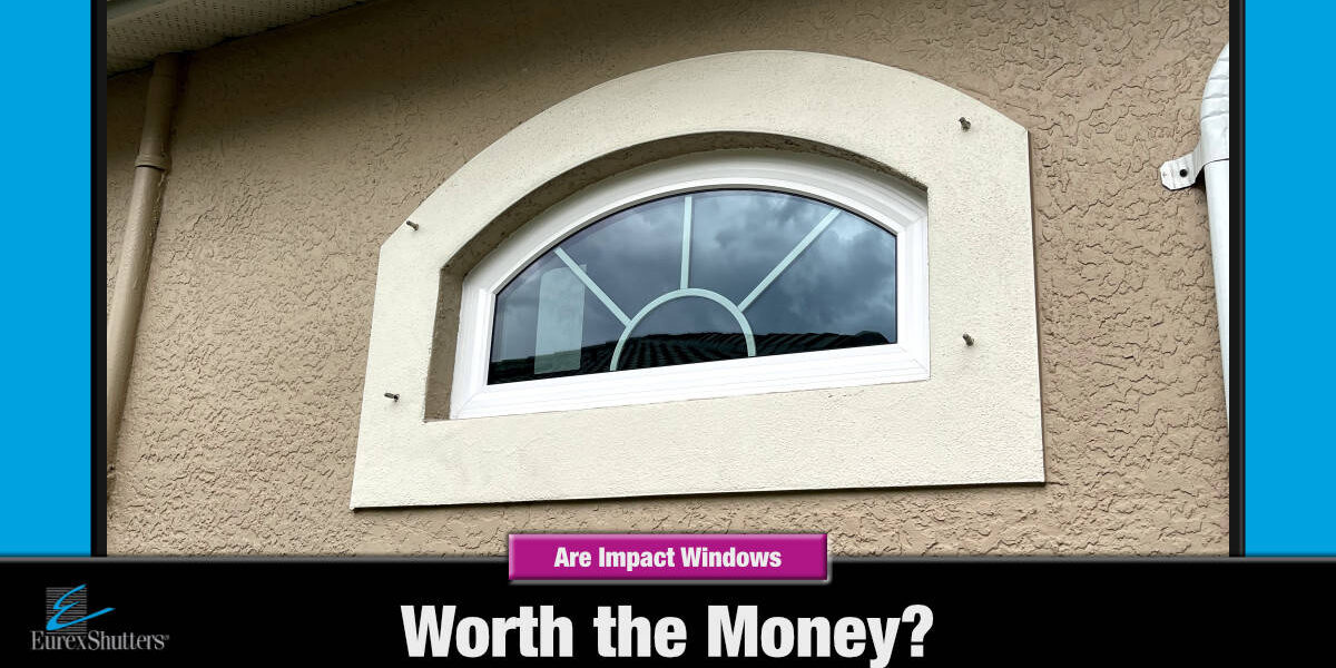 are-impact-windows-worth-the-money An architectural impact window on a beige home with text are impact windows worth the money