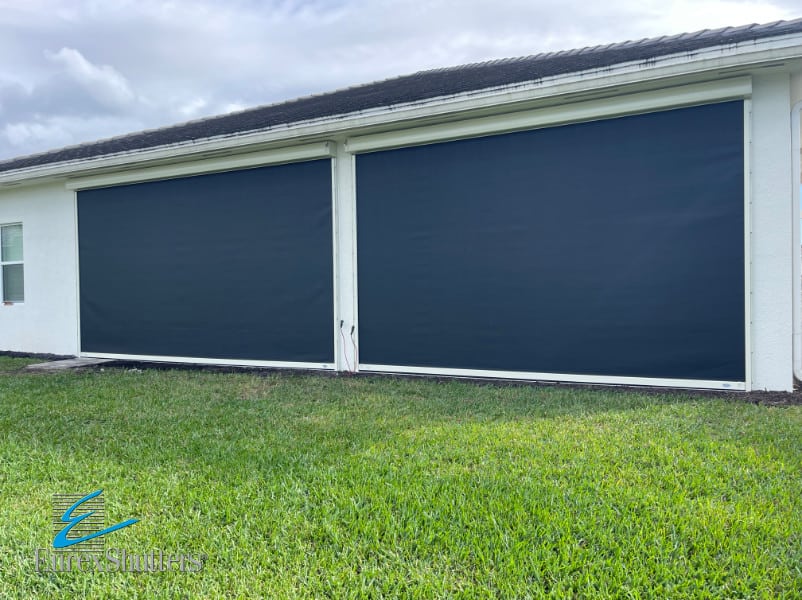 Black hurricane screens with ivory tracks and housings in the closed position on a home in Bonita Springs FL