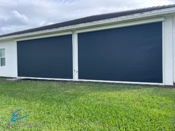 Black hurricane screens with ivory tracks and housings in the closed position on a home in Bonita Springs FL