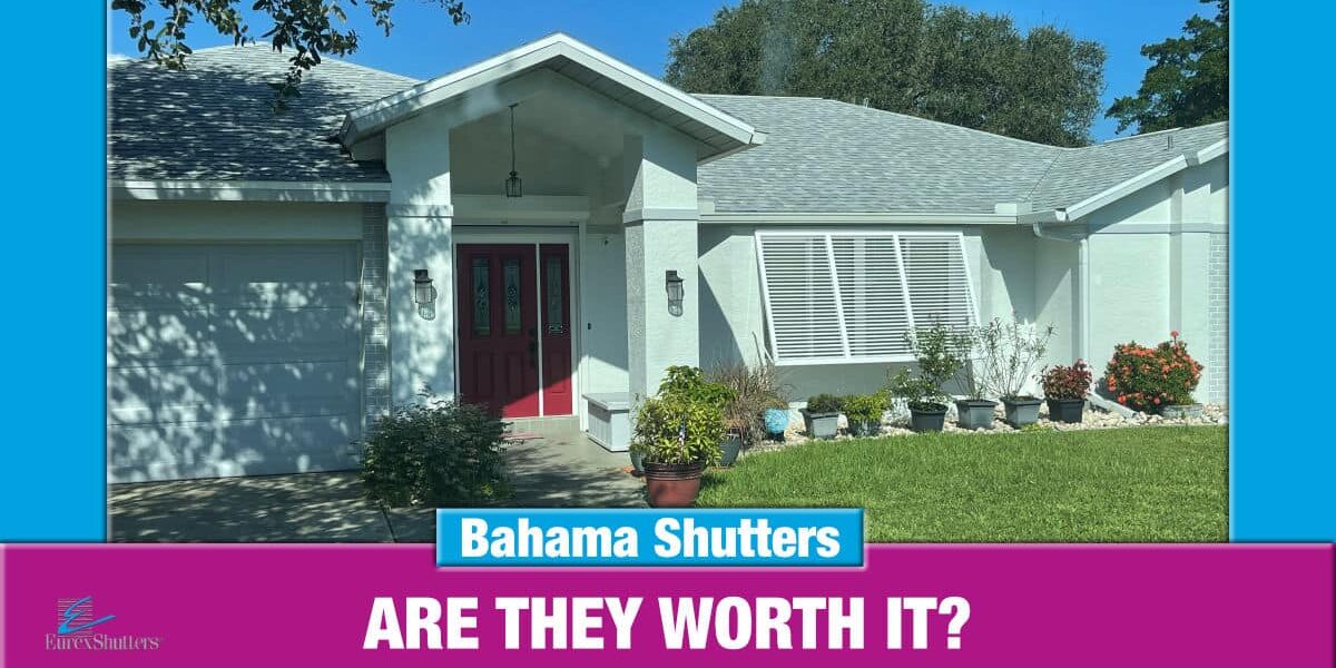 White bahama shutters on a green home