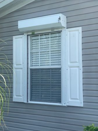 White manual roll down shutters open