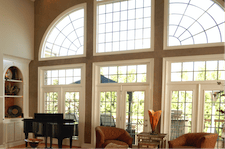 white, aluminum frame picture window with impact glass shown in several shapes and sizes with window grids
