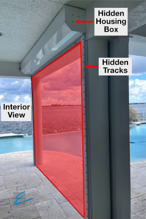 Interior view of a hidden roll down hurricane shutter installation showing the interior view of the housing box and tracks hidden from exterior view.