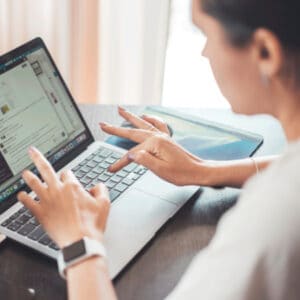 Woman typing on a computer