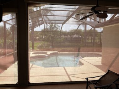 Tan hurricane screens view from inside lanai