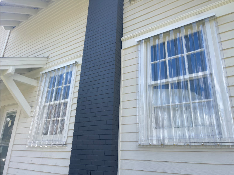 Corrugated storm panels over the windows of a home in Fort Myers