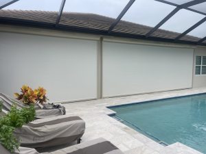 White, aramid screens installed over two openings of a lanai.