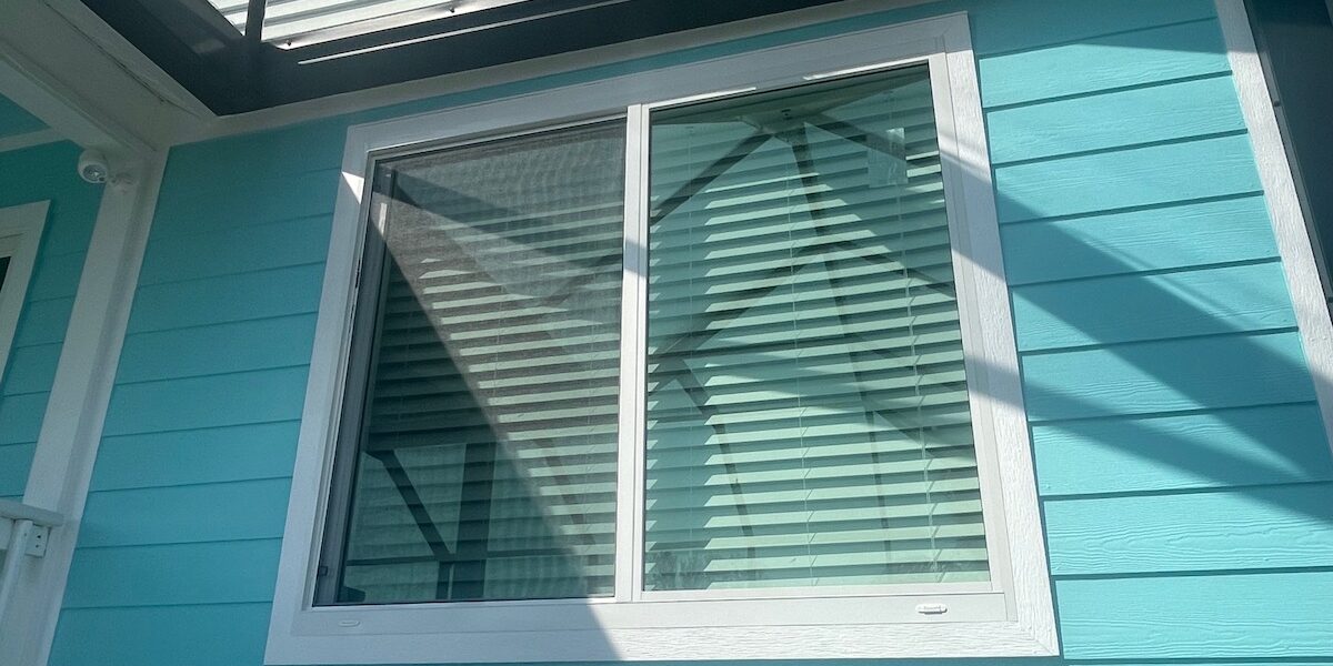 White vinyl sliding impact windows