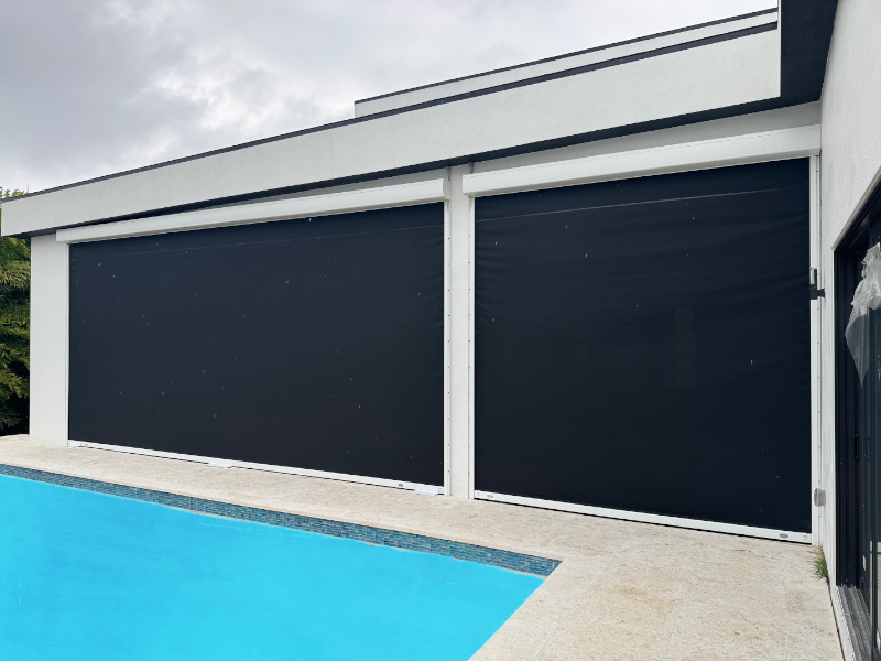 Black hurricane screens shown enclosing the lanai of a pool home in Fort Myers Florida