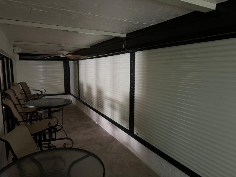 Closed hurricane shutters on the balcony of a condo unit in Sanibel
