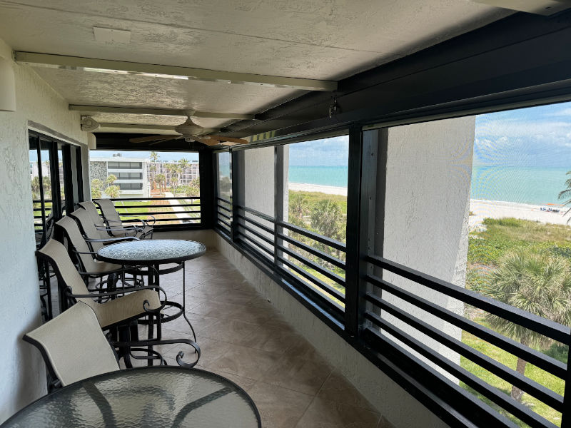 Open hurricane shutters on the balcony of a condo unit in Sanibel