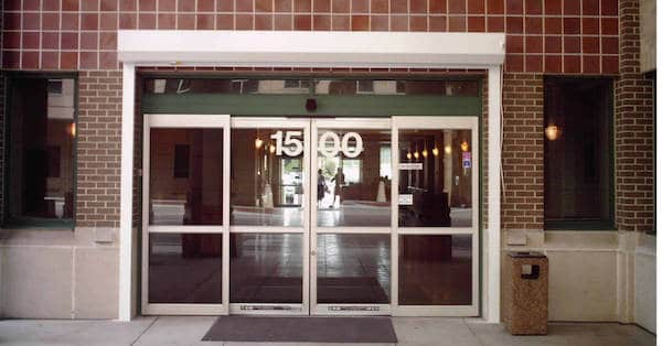 Exterior roll shutters shown on the exterior of a commercial building in Fort Myers, FL.