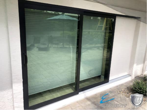A traditional, 2 panel glass sliding door with impact resistant glass