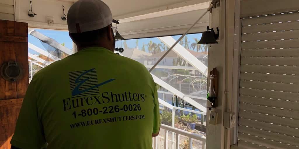 Hurricane shutter repair tech testing roll down shutters