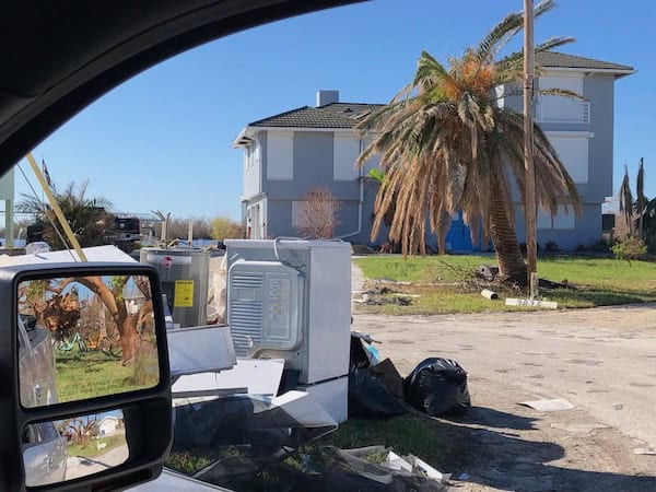 Roll down security shutters installed on a residential home in Florida, shown securing a home after a hurricane.
