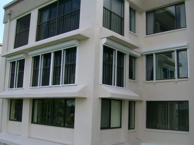 Hurricane shutters on the exterior of a condo HOA