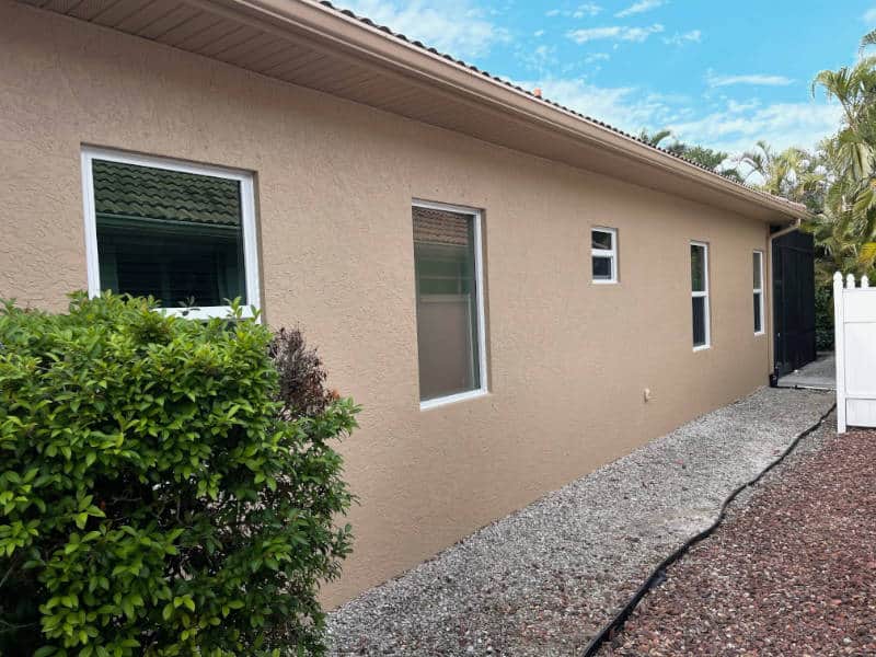 Newly installed windows on a beige home in Florida.