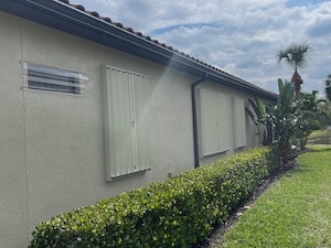 Accordion shutters on a ranch home in Cape Coral.