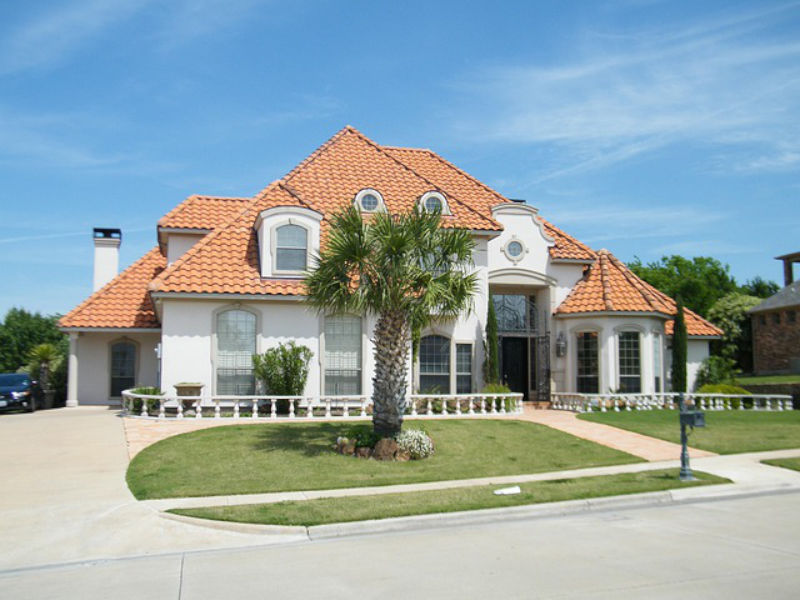 Spanish Colonial home with palm trees