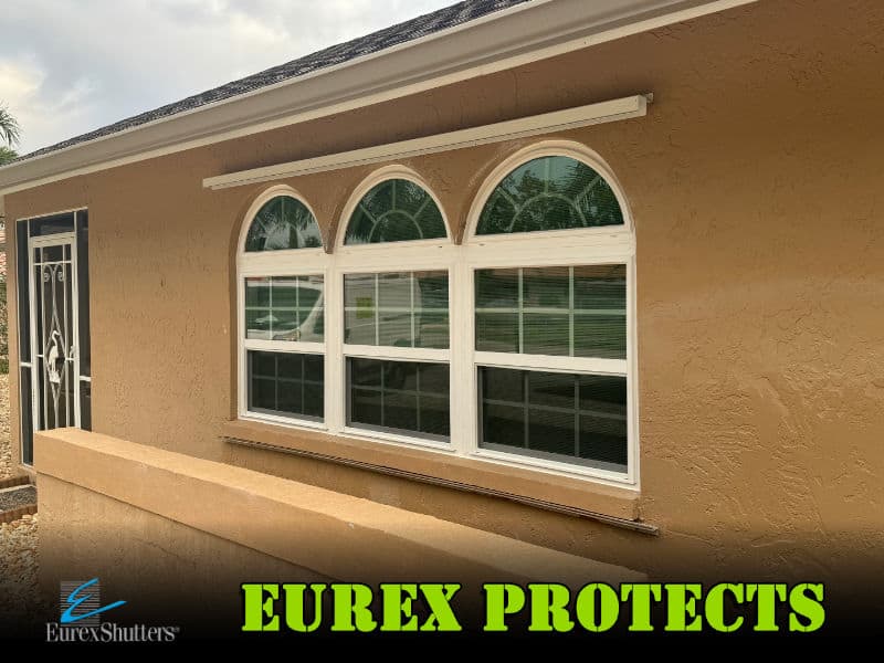 New impact windows installed on a home in Lee County FL with the text "Eurex Protects".